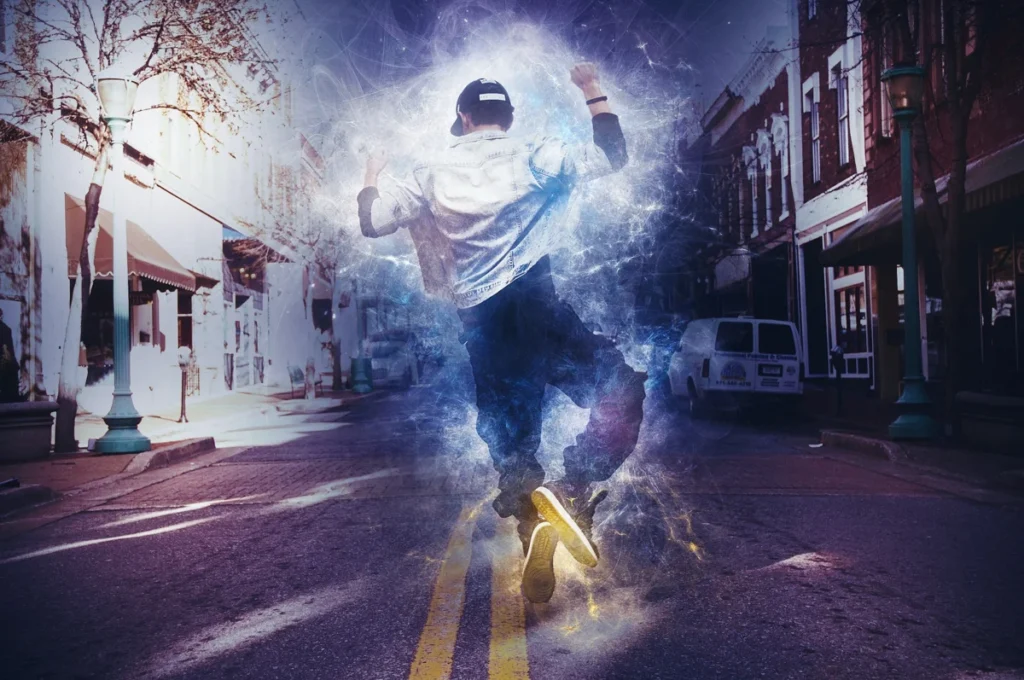 A young man is dancing hip-hop in the middle of the road. The atmosphere is dreamy.